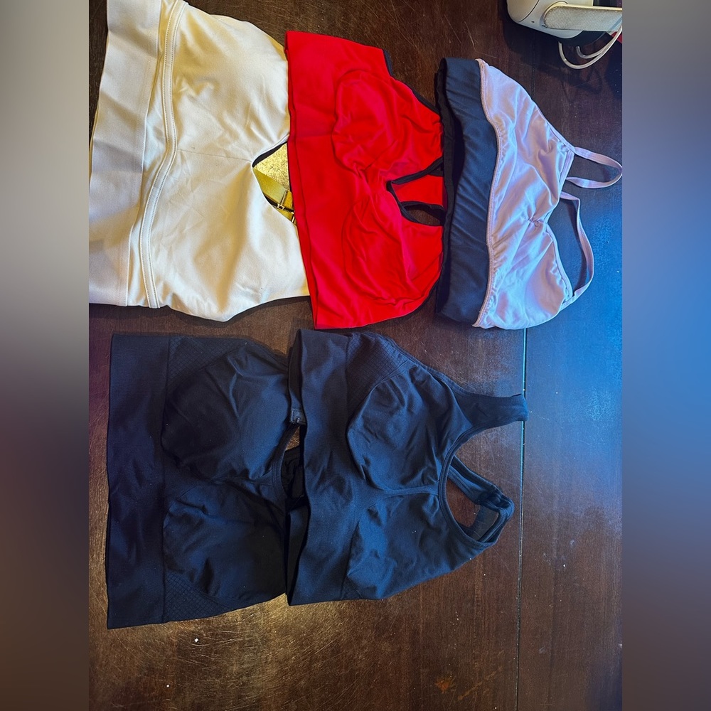 5 amazing condition size M sports bras 2 black 1 ivory 1 red 1 purple